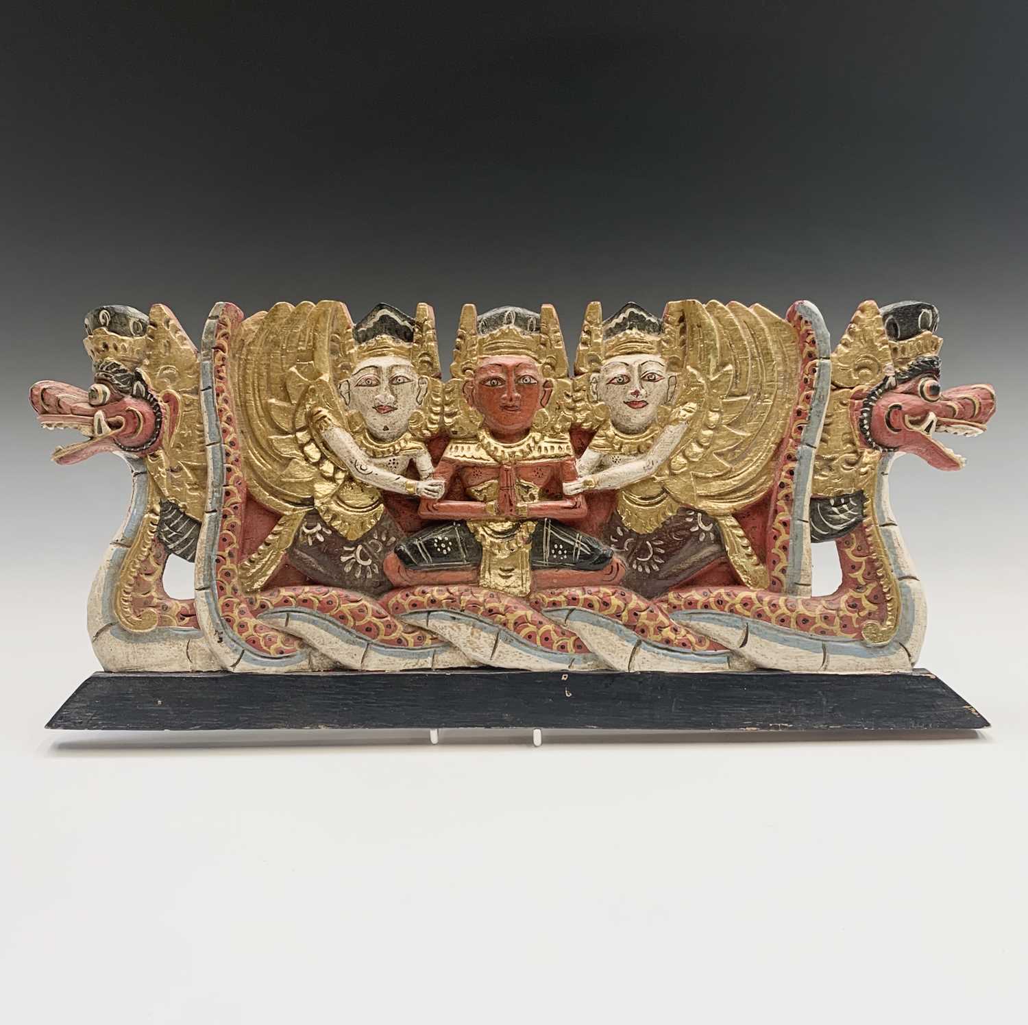 Lot 419 - A Thai gilded carved wood panel, 22 x 51cm.