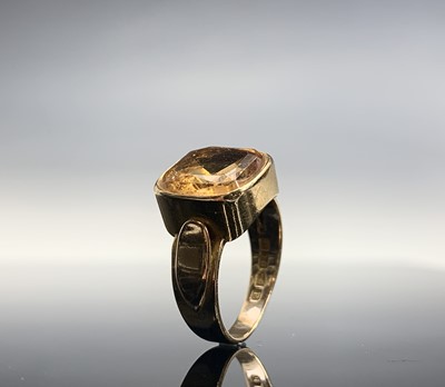 Lot 404 - A Victorian 18ct gold ring set a citrine by...