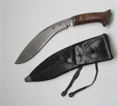 Lot 43 - A World War II kukri knife with wooden grip,...