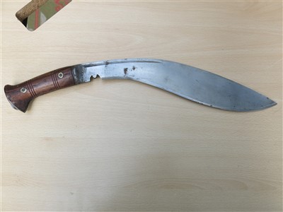 Lot 43 - A World War II kukri knife with wooden grip,...