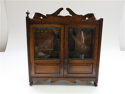 Lot 6 - An Edwardian oak smokers cabinet, height 45cm,...