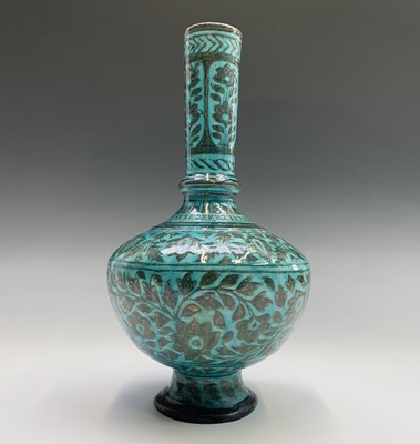 Lot 428 - A Persian pottery bottle vase, the turquoise...