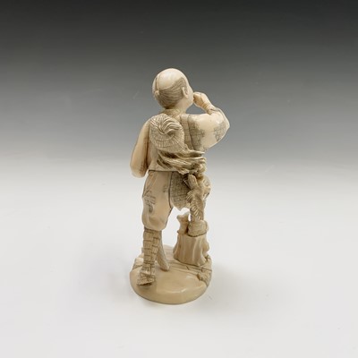 Lot 201 - A Japanese ivory figure of a hunter, Meiji...