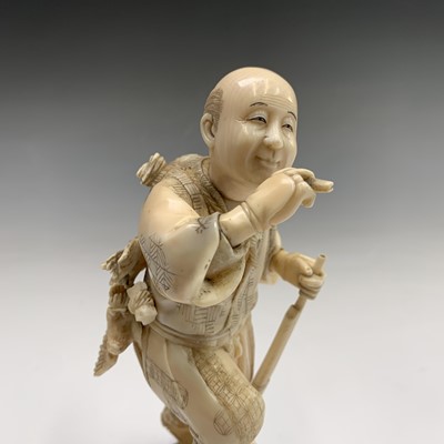 Lot 201 - A Japanese ivory figure of a hunter, Meiji...
