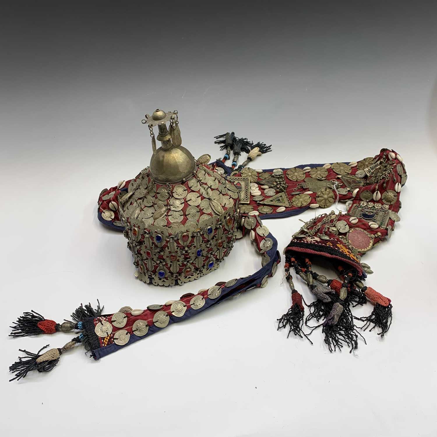 Lot 433 - A Central Asian headdress, with metal mounts...