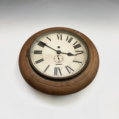 Lot 2914 - A small oak cased circular station wall clock,...