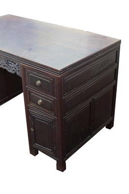 Lot 100 - A Chinese hardwood twin pedestal desk, late...