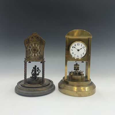 Lot 2929 - A brass 400 day torsion mantel clock, the...