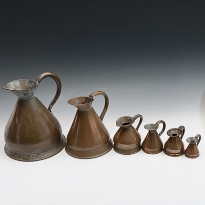 Lot 479 - A group of six Victorian copper measuring jugs...