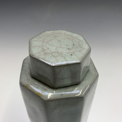 Lot 1044 - A studio pottery octagonal celadon glaze jar...