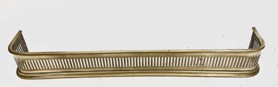 Lot 679 - A 19th century pierced brass fender. Overall...