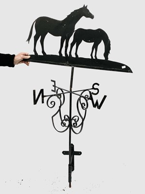 Lot 2027 - A wrought metal weather vane surmounted by a...