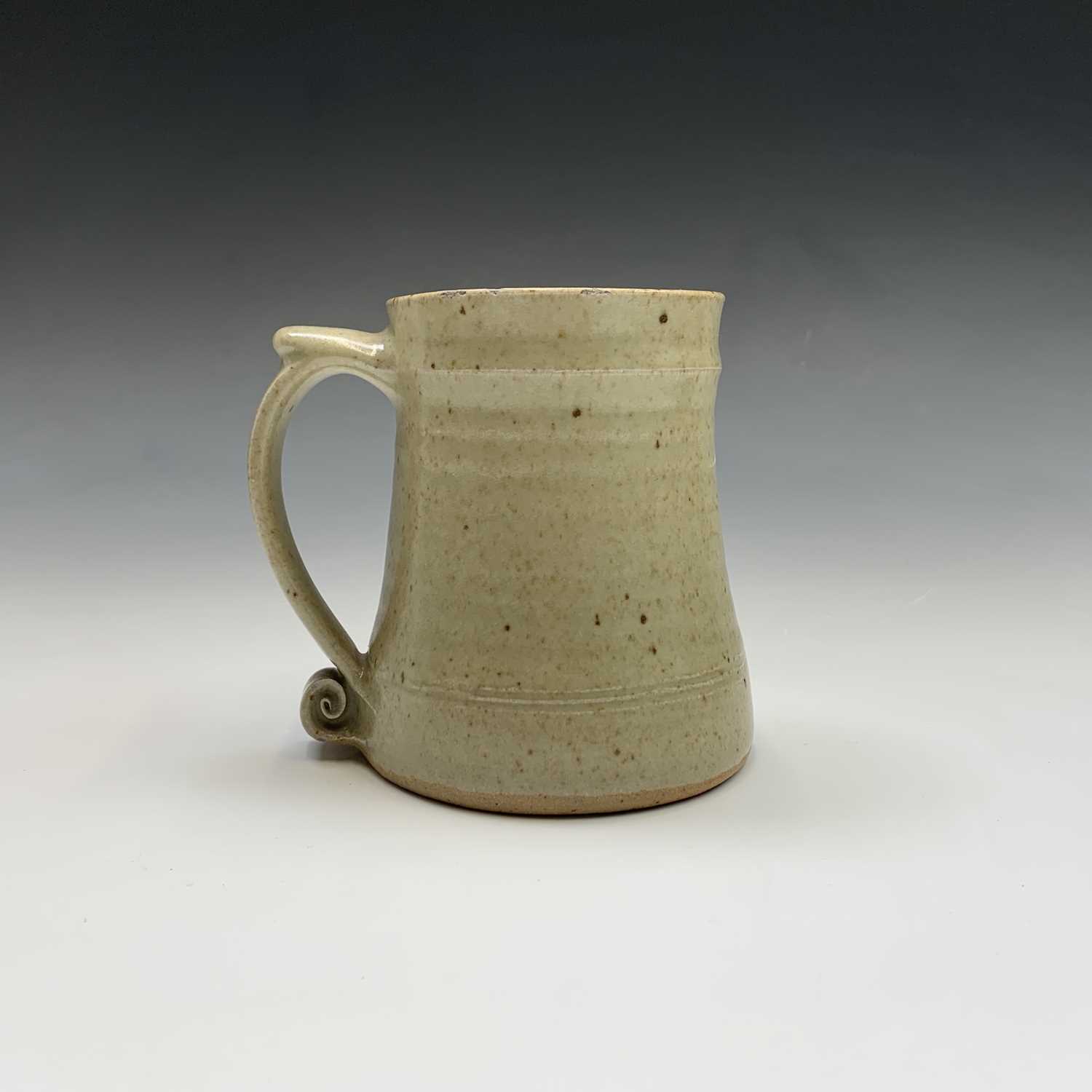 Lot 1083 - A Leach studio pottery mug, the handle with...