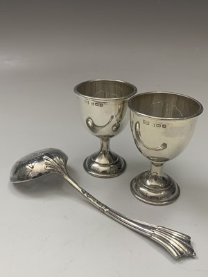 Lot 121 - A pair of plain silver egg cups, a late...