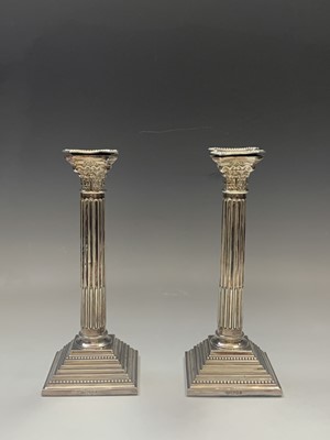 Lot 1056 - A pair of filled silver classical column...