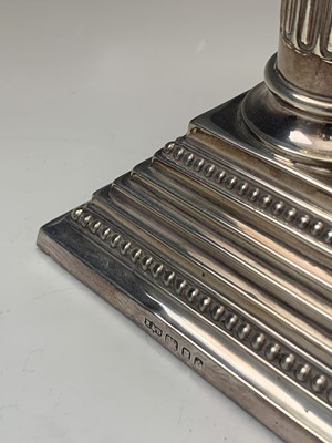 Lot 1056 - A pair of filled silver classical column...