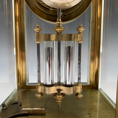 Lot 2938 - A four glass brass mantel clock, the two part...