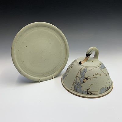 Lot 1056 - An art pottery cheese dome, with incised swan...