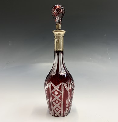 Lot 131 - A Bohemian silver mounted cut overlay decanter...