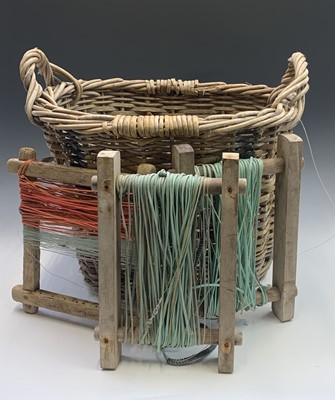 Lot 535 - Two Newlyn wicker fish baskets, one with corks...