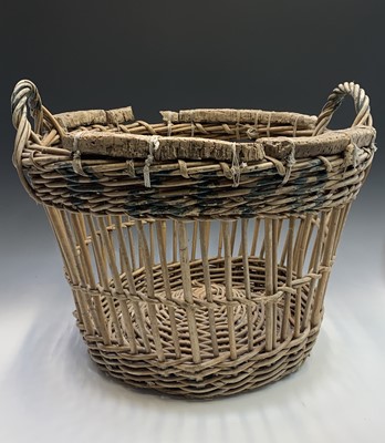 Lot 535 - Two Newlyn wicker fish baskets, one with corks...