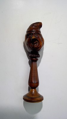 Lot 629 - A 19th century fruitwood nutcracker, carved...