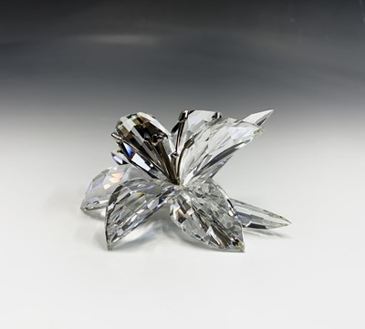 Lot 239 - Swarovski Crystal - an orchid ornament, height...
