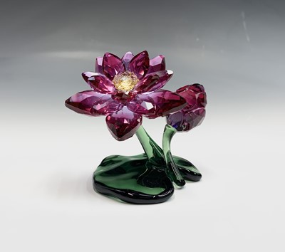 Lot 239 - Swarovski Crystal - an orchid ornament, height...