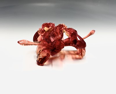 Lot 239 - Swarovski Crystal - an orchid ornament, height...