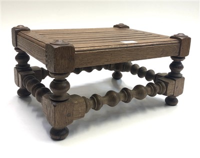 Lot 550 - An oak footstool, with slatted top, applied...