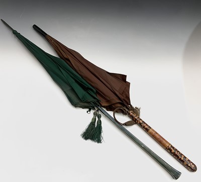 Lot 2812 - Two long handled parasols, one with hand...