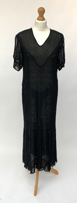 Lot 2844 - An elegant black lace 1920s short sleeved full...