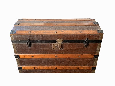 Lot 271 - A metal bound wooden dome top steamer trunk,...