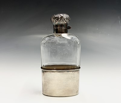 Lot 137 - An Edwardian cut glass flask with silver cup...