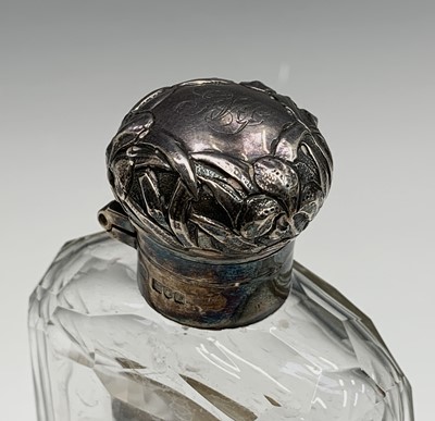 Lot 137 - An Edwardian cut glass flask with silver cup...