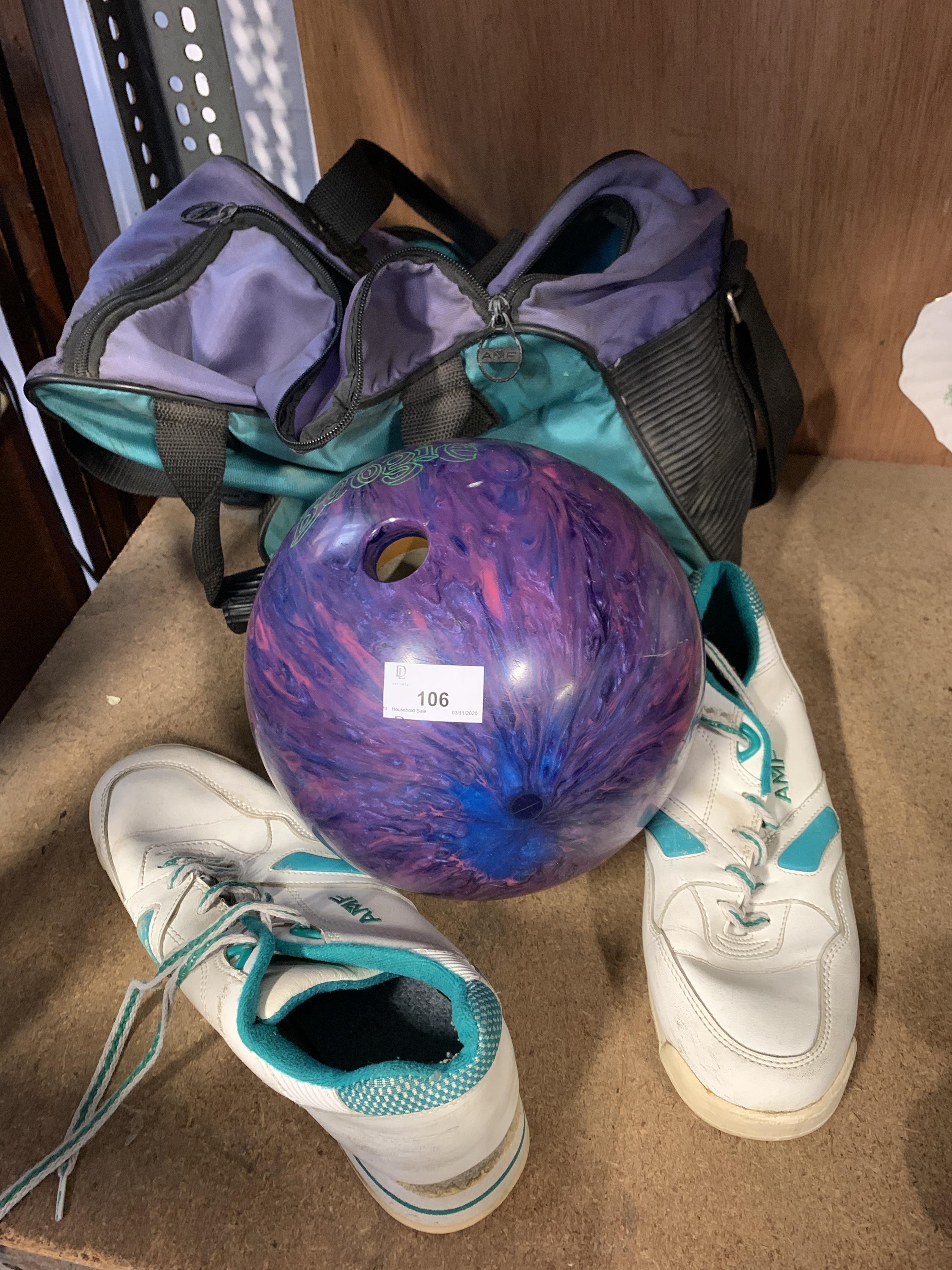 Lot 106 A bowling ball and shoes.