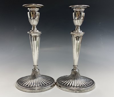 Lot 1083F - A pair of Adam style silver candlesticks by...