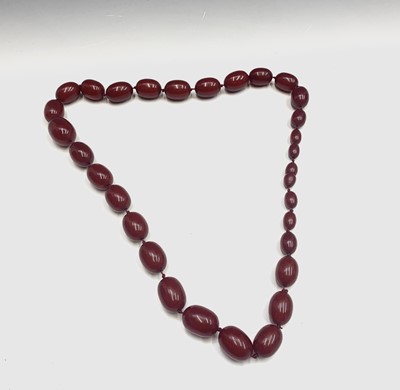 Lot 530 - A handsome "Cherry Amber" necklace maximum...