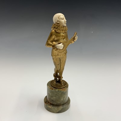 Lot 621 - A French Art Deco period gilt bronze and ivory...