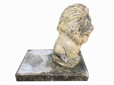 Lot 2035 - A reconstituted stone lion on a rectangular...