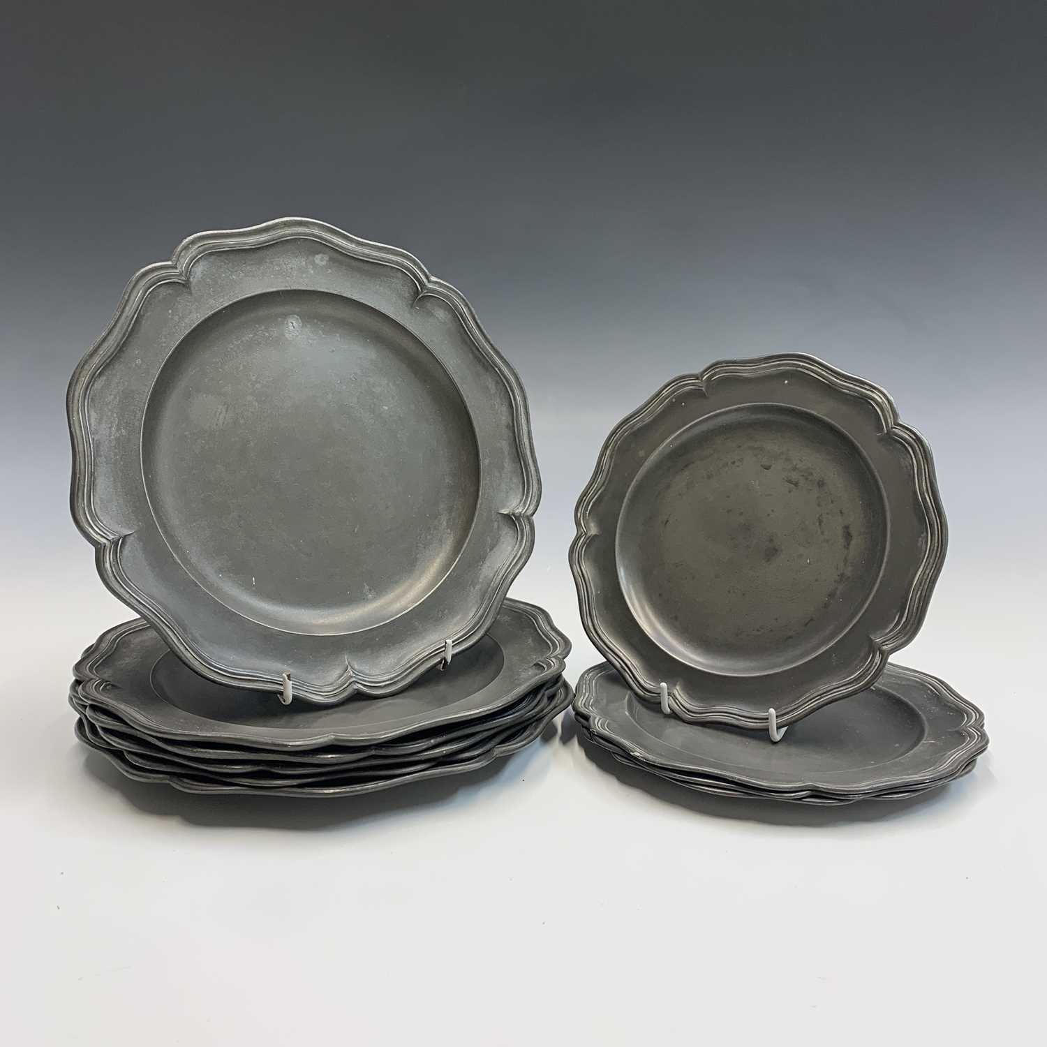 Lot 677 - A set of six pewter dinner plates, early 19th...