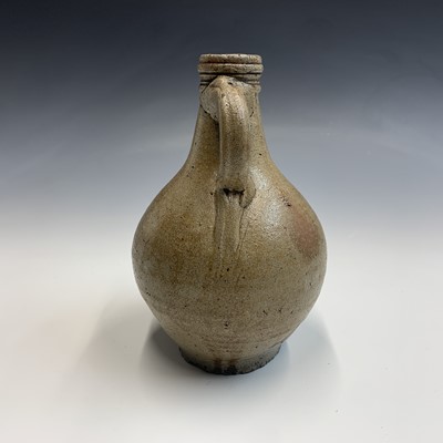Lot 1107 - A 17th century Stoneware Bellarmine jug, with...