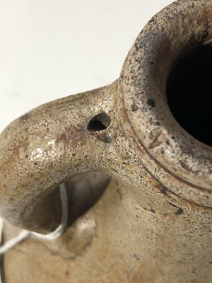 Lot 1107 - A 17th century Stoneware Bellarmine jug, with...