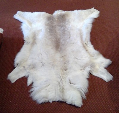 Lot 2857 - A reindeer fur rug. 122cm x 102cm.