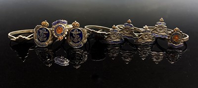 Lot 692 - Ten silver and enamel rings each with a...