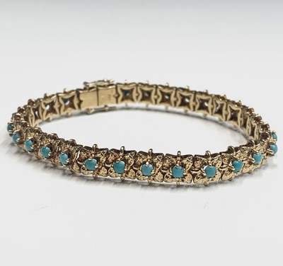 Lot 318 - An 18ct gold bracelet set to the square...