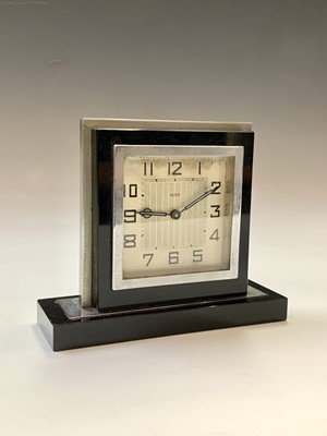 Lot 245 - A black glass and nickel plated Art Deco clock....