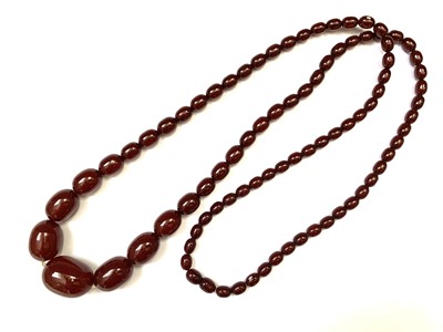 Lot 331 - A 'Cherry Amber' necklace, 69gm.