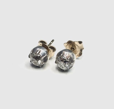 Lot 632 - A pair of diamond stud earrings, each stone of...