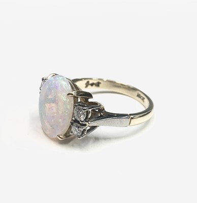 Lot 644 - An 18ct gold ring, set an oval opal measuring...